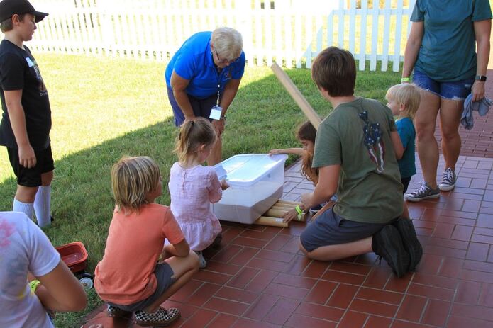 PILH Volunteer Cindy Horn teaches students about how simple machines helped build the lighthouse